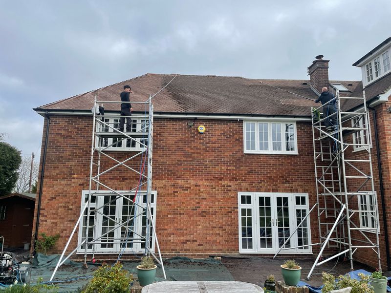 Roof cleaning carried out safely from scaffold towers by The Roof Moss Cleaners in Tetbury